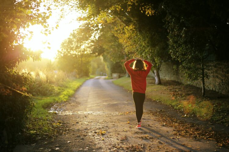 Young woman going for walk in woods