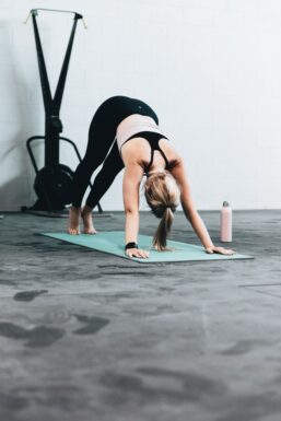 Image of female demonstrating the downward dog yoga pose 